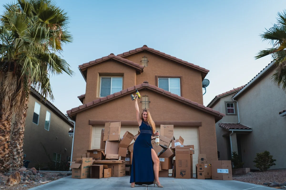Woman in a black dress standing outside a concrete building during a Florida divorce
