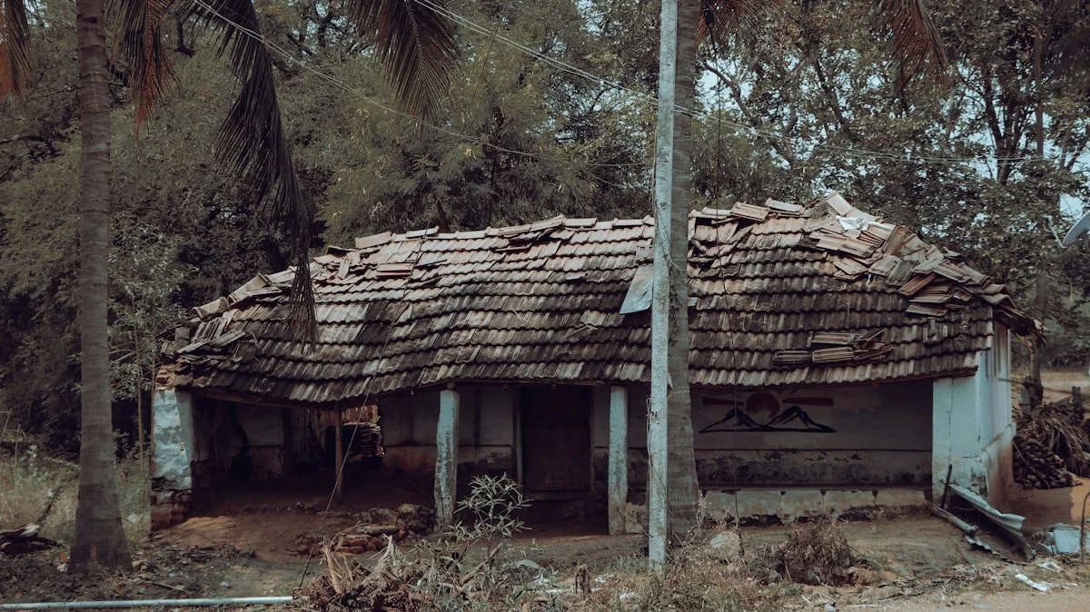Exterior of a weathered Florida house with an aging roof needing repairs