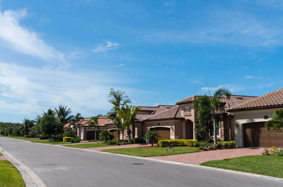White and brown painted single-family house in a Florida neighborhood